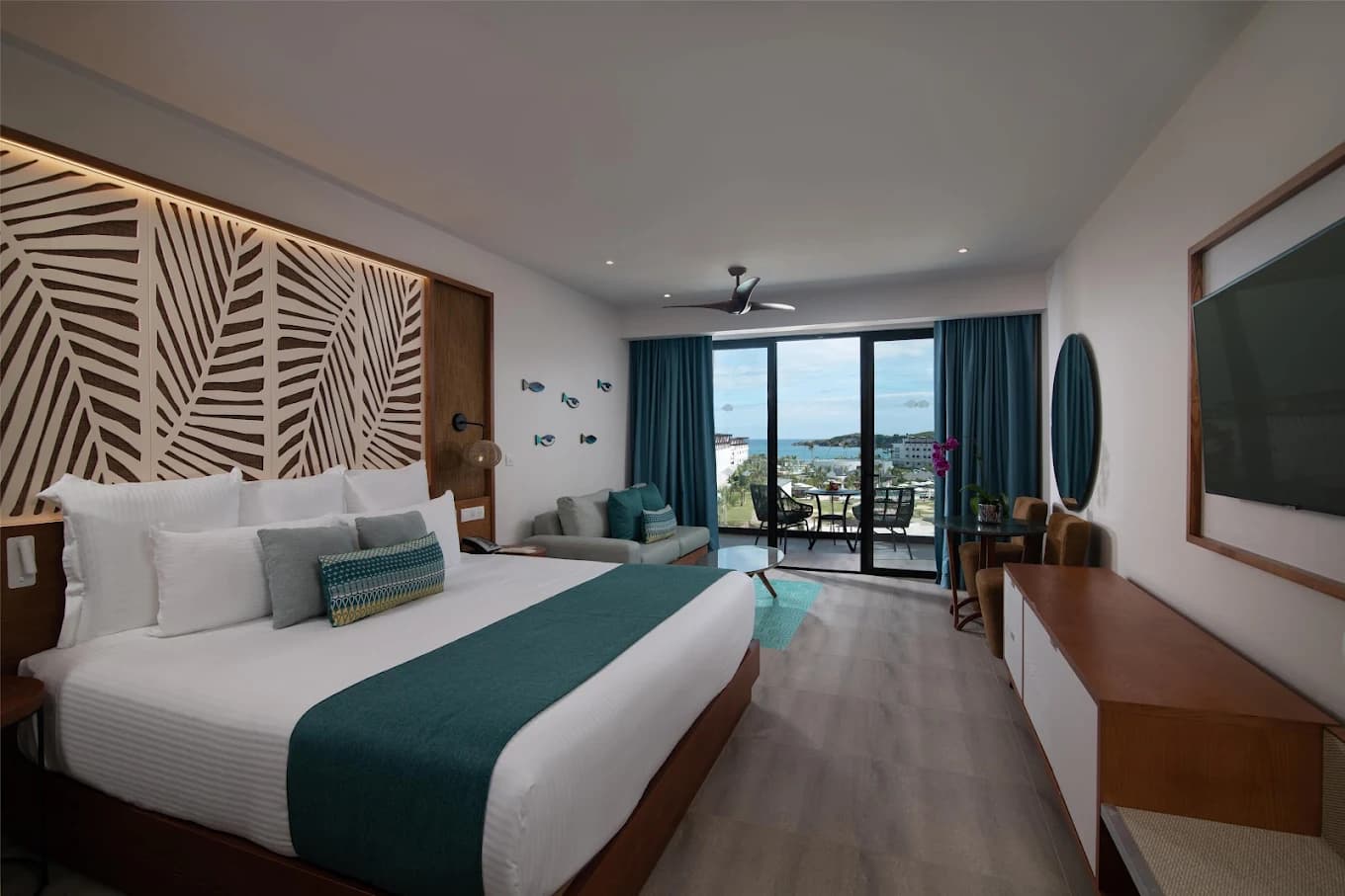 Suite bedroom with ocean view balcony